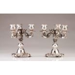 A pair of Portuguese silver three-light candelabra
Relief decoration in the baroque manner
Porto