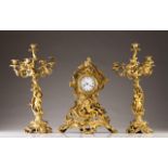 Garniture
Comprising a clock and a pair of six-light candelabra
Gilt and chiseled bronze with