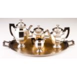 A CHRISTOFLE tea and coffee set
Faceted decoration, fluted friezes and wood handles
Comprising: