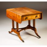 A Regency sofa-table
Mahogany
Two drawers and twin flap top
Turned legs and bronze zoomorphic feet