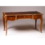 A Louis XV bureau-plat
Gilt bronze mounted kingwood
Three drawers, brown leather top
(defects)