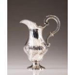 A 19th century Portuguese silver ewer
In the D.José style
Spiral and relief decoration with floral