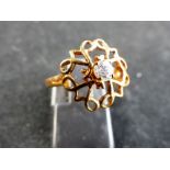 9 ct rose gold stone set openwork ring.