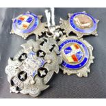 Four silver and enamel fobs from the 192