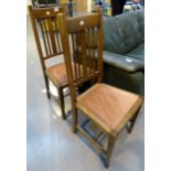 Pair of upholstered oak dining chairs on tapered legs