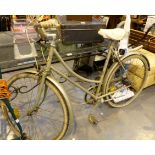 Vintage ladies BSA bicycle on green frame.