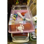 Two pet cages one with accessories