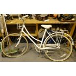 Vintage ladies Raleigh Caprice bicycle with white frame.