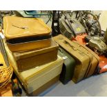 A quantity of vintage suitcases