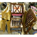Four wooden fold out deck chairs