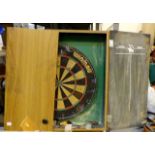 Wooden cased darts board including darts.