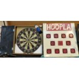Cased darts board and a hoopla board