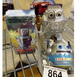 Four collectable toy robots including a tin plate example