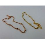Two sterling silver bracelets, one gold plated and one rose gold plated.