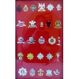 26 military cap badges including The Royal Hussars and Queenstown Hussars,