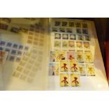 Two albums of British postage stamps and first day covers