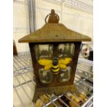 Vintage cast iron exterior lantern with bee decoration