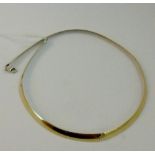 Reversible sterling silver and gold plate choker.