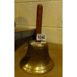 Antique school bell with wooden handle
