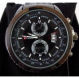 Black multi dial/function day date Curren wristwatch with metal strap.