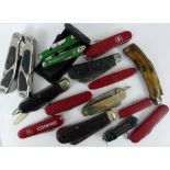 Selection of penknives including Swiss Army knives