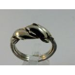 Silver ring with dolphin design.