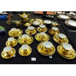 Gold fired china tea and coffee sets with hand painted decorative panels,