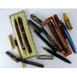 Six pens with 14 ct gold nibs comprising three Conway Stewart, Watermans, Shaffer and Caran D'ache,