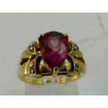 9ct yellow gold red andesine and diamond set ring. 4-58g. Size N.
