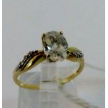 9 ct yellow gold solitaire set with diamond shoulder ring. Size M.