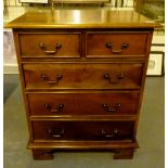 Modern hardwood chest of two short over three long drawers.