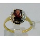 9 ct gold diamond and garnet ring.