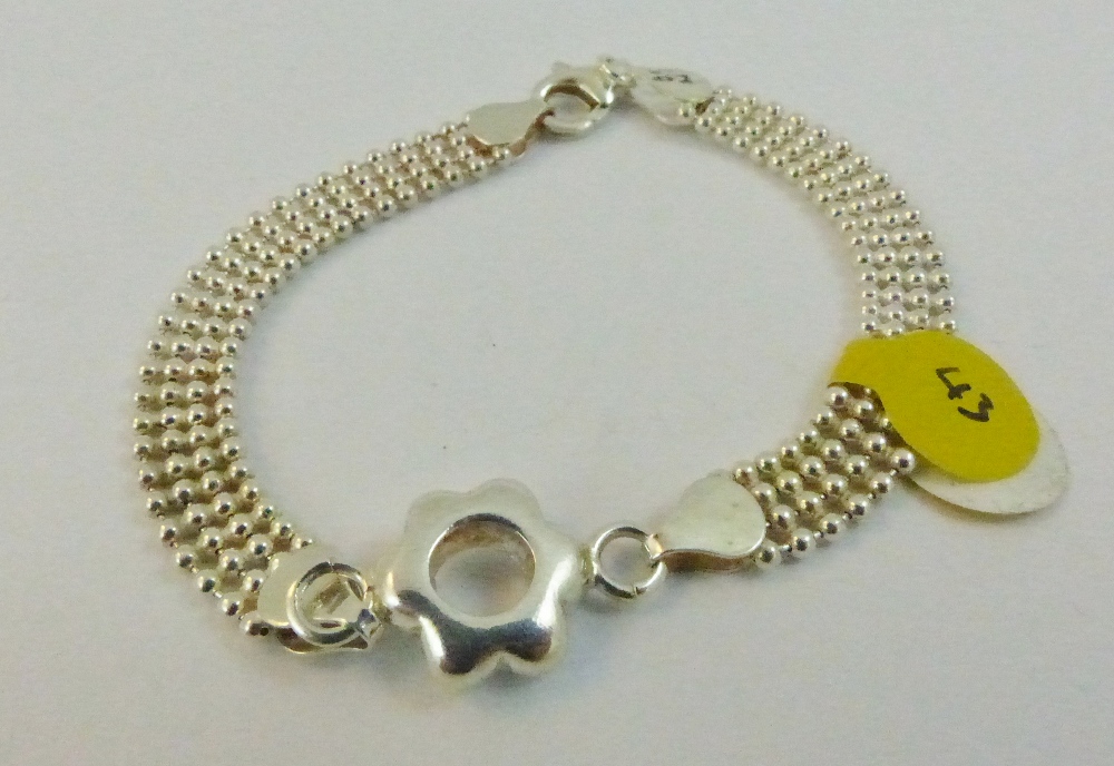 Sterling silver fancy bracelet with flower centre