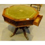 Octagonal mahogany side table with green leather central insert,