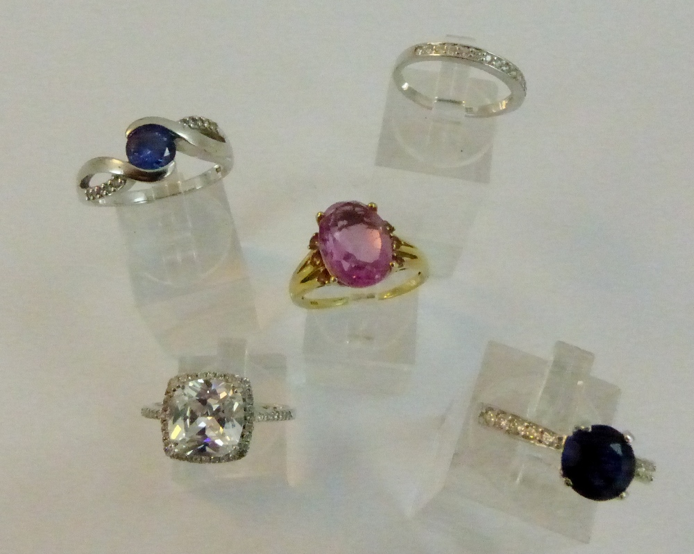Five .925 sterling silver rings with a variety of set stones.