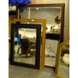 Three large vintage wooden framed mirrors.