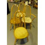 Four stickback elm seated dining chairs including a carver.