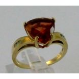 9 ct yellow gold red andesine and diamond set ring. 3g. Size N.