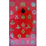 28 military cap badges including Military Foot Police, Army Cyclist Corp and Army Ordnance Corp,