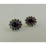 9 ct gold amethyst and C/Z cluster earrings,