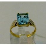 9 ct gold diamond and blue topaz ring 1.