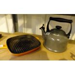 Le Creuset modern hob kettle and cast metal branding pan