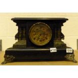 Old wood framed black mantel clock