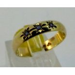 9 ct gold band with three sapphires size M