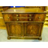 Lift top writing desk in the form of a two drawer chest of drawers with double door underneath