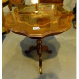 Inlaid top occasional table with central support and four carved legs