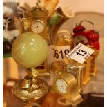 Quantity of miniature brass clocks and a brass and onyx globe