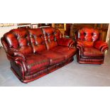 Ox blood leather three seater settee and armchair by Thomas Lloyd