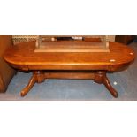 Heavy oak oval coffee table with double pillar supports