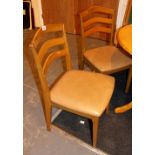 Set of four modern ladder back dining chairs with leatherette seats